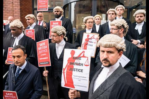 Criminal barristers from the Criminal Bar Association (CBA), which represents barristers in England and Wales, outside Leeds Combined Court